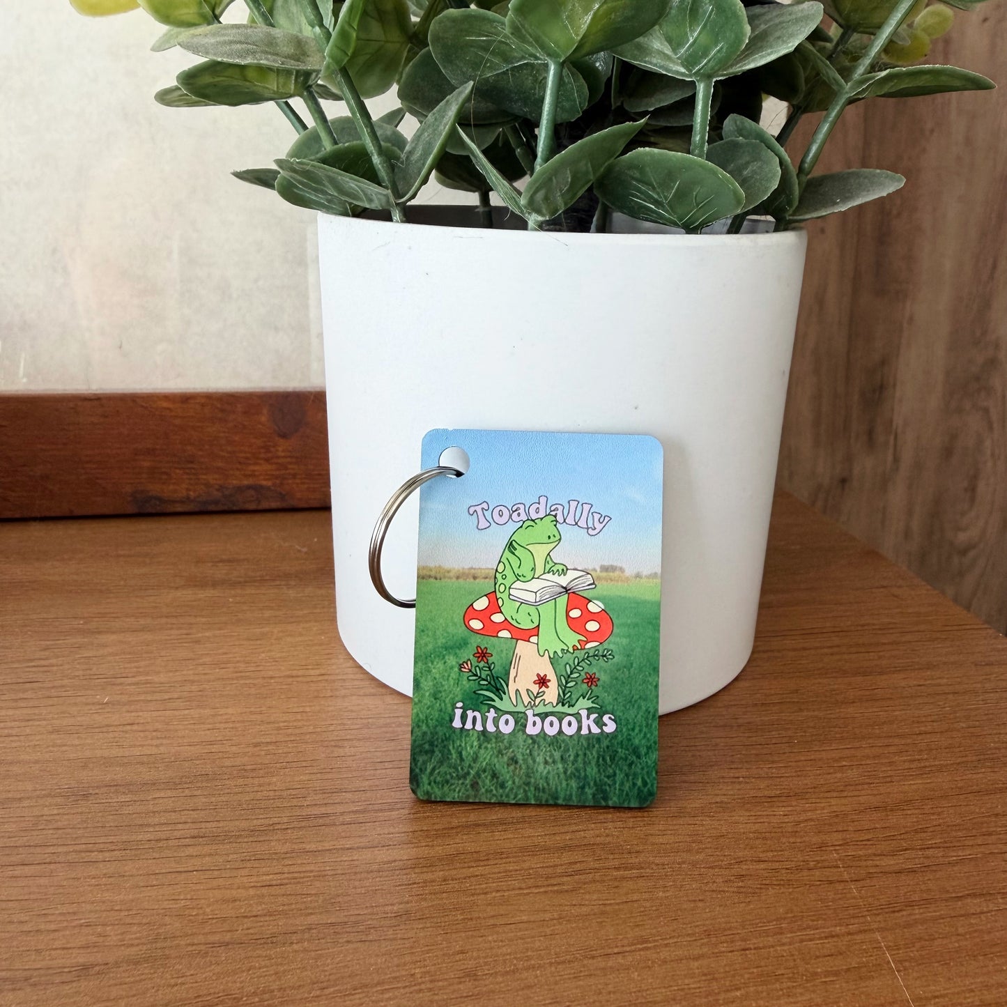 Toadally Into Books Keychain