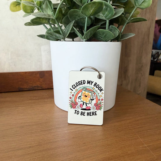 I Closed My Book To Be Here Keychain
